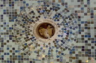 Detailed mosaic tiling around drain